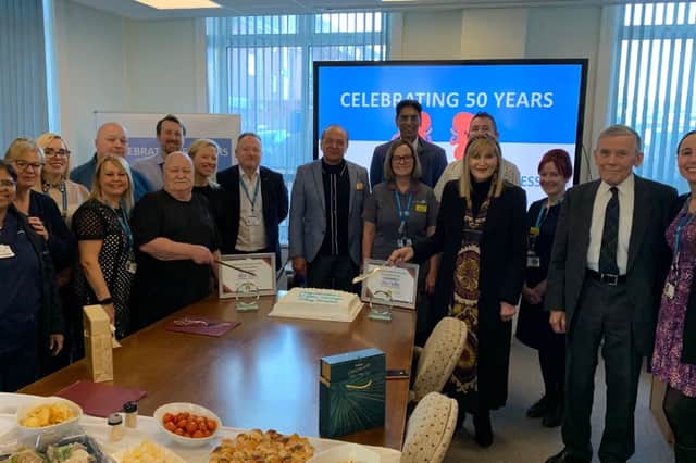 Patients Robert Hughes and Sue Westhead cut their celebration cake at a celebration which brought together Trust leaders, transplant experts and members of Sunderland Royal Hospital's Renal Team. Submitted picture.