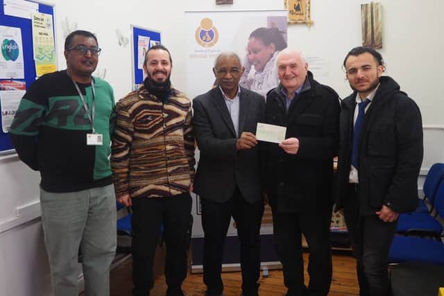 Tom Fennelly (second right) Co-Chair of the Sunderland, Shields & Hartlepool Branch of the NUJ, hands over a cheque for £100 to Dr Mohamed Naseldrin, Director of the North of England Refugee Service, watched by (left to right) Adam Farah (NERS), Shaho Omar ( NUJ) and Ako Ismail (NUJ). Submitted picture.