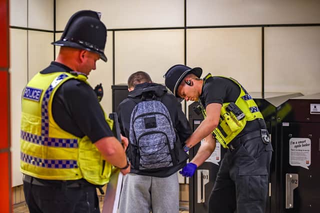 Officers carry out checks at a Metro station
