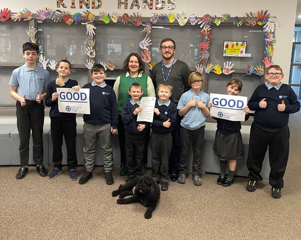 School Council pupils join SEND coordinator Dan Moreno, Senior Leader Lisa Winship and Floyd the school dog to celebrate their good Ofsted.