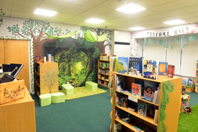 The library has been created around the theme of an enchanted forest.