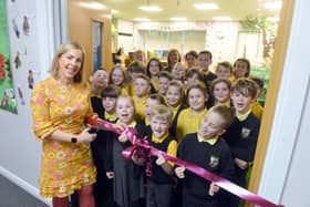 Liz Million officially opens the school's new library.