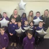 Staff and children at Hasting Hill Academy celebrate their good Ofsted report.