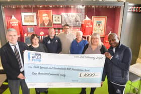 Gary Bennett hands over a cheque to Consultant Urological Surgeon and Clinical Director at Sunderland Royal Hospital, Stuart McCracken. Back from left, cancer nurse Jeanette Maughan, Fans Museum founder Michael Ganley, Mick Harford, Ron Hedley and Urology Directorate Manager Emma Scott.