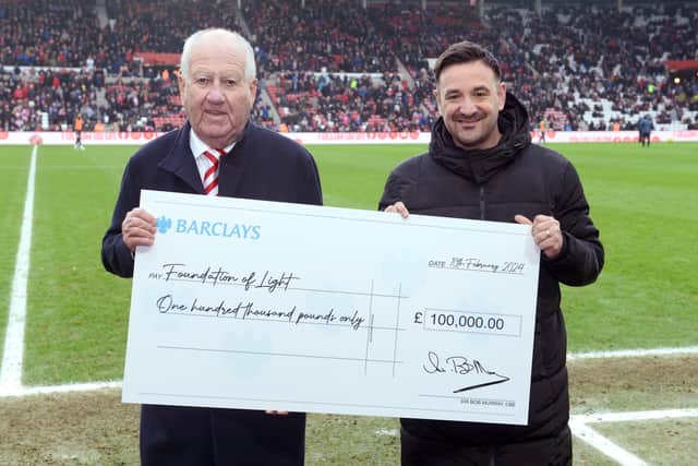 Bob Murray presents Foundation of Light, MD Jamie Wright with a cheque for £100,000 at the Stadium of Light.