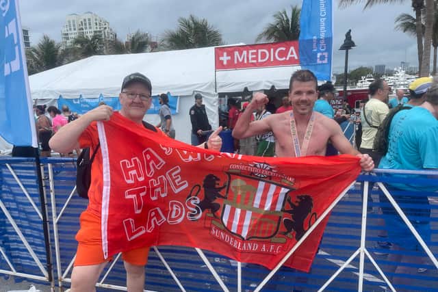 Paul Holborn, right, with friend and supporter Jeff Cowell after the Fort Lauderdale Marathon.
