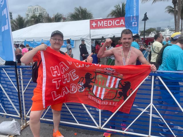 Paul Holborn, right, with friend and supporter Jeff Cowell after the Fort Lauderdale Marathon.