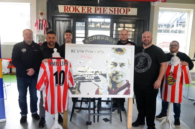 Screw Art artist Darren Timby (second right) and Kevin Phillips with Fans' Museum founder Michael Ganley (left) and representatives of sponsors  JT Dove Building Materials and Nordstrom Timbers