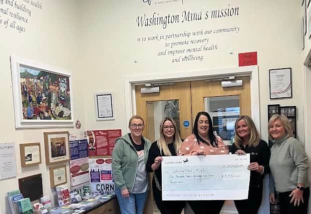 Ray's family handed over a cheque for more than £5,000 to Washington Mind