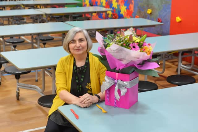 Carole was presented with a bouquet of flowers by the children.
