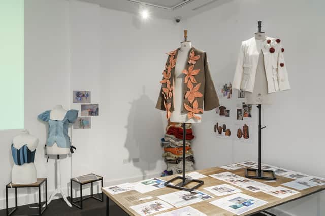 The clothing range is on display as part of an exhibition.