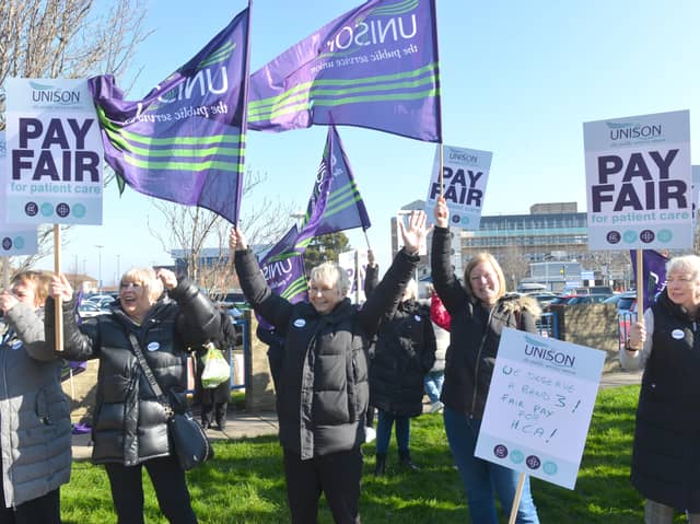 Healthcare assistant Sarah Birrell (centre) is joined by colleagues at the protest. 