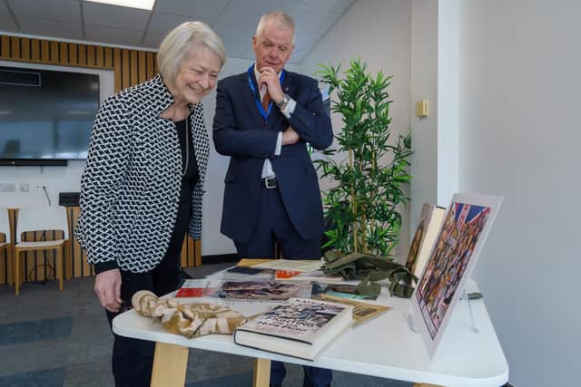 Kate Adie alongside Vice Chancellor Sir David Bell and some the items chronicling her career.