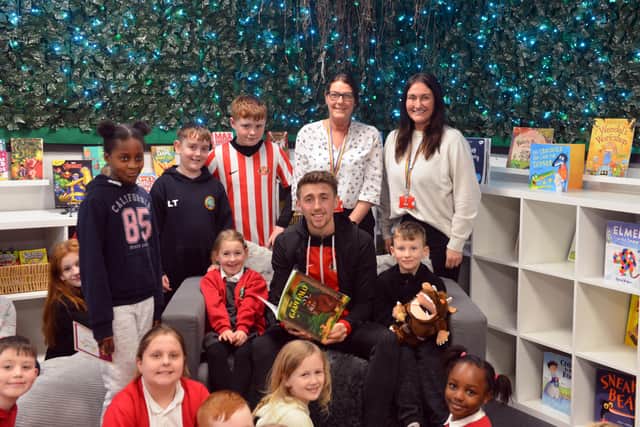 SAFC star Dan Neil was visiting Plains Farm Academy to open the school's new library.