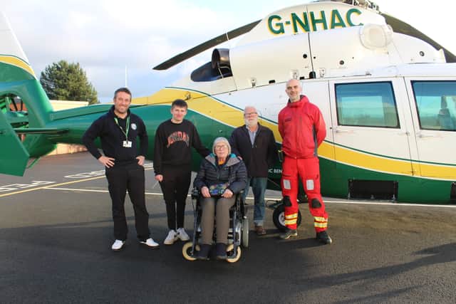Ben Sisson, specialist fundraiser, Corey Russell and his grandparents and GNAAS paramedic Ian Grey