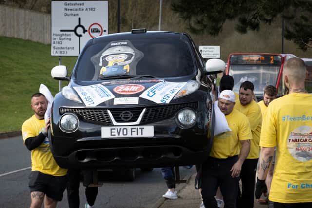 The team carried the Nissan Juke for seven miles. Photo by Glenn Sowerby