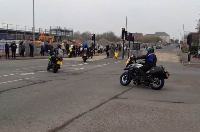 Spectators watch the start of the Easter Egg Run 2023 at Dragonville.