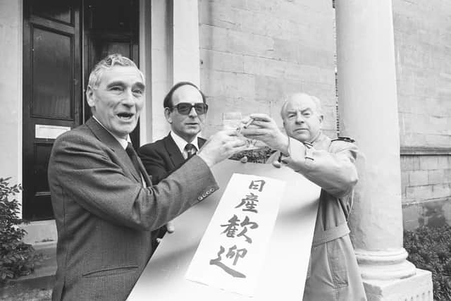 'Welcome to Nissan' reads the message held by Mr Fuller Osborn, Deputy Chairman of Washington Development Corporation; Councillor Charles Slater, Leader of Sunderland Borough Council; and Councillor Michael Campbell, Leader of Tyne and Wear Council.