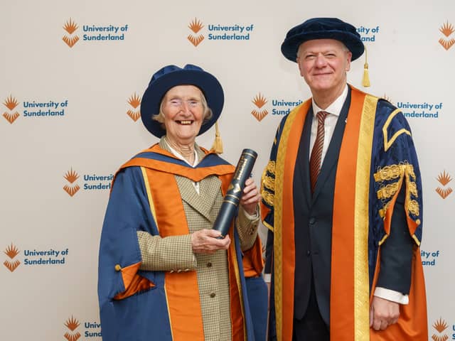 Sheila Coates, 91, holding her degree alongside the university's vice chancellor Sir David Bell.