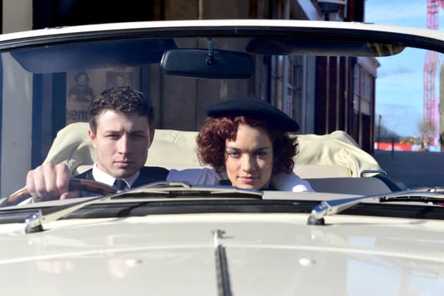 The pair posed in a car loaned by Classic Wedding Cars North East

