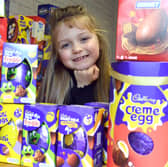 Annalise Lawton, 7, with some of the Easter eggs she is donating.