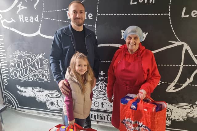Annalise Lawton with with dad Kristopher delivering the eggs to Sunderland Community Soup kitchen.