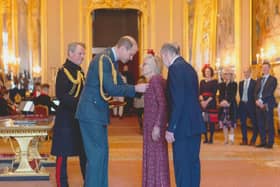 Gill and John Griffith receiving their MBEs from Prince William at Windsor Castle.