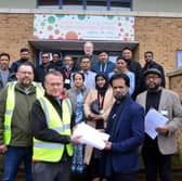 Sunderland Bangladesh International Centre vice chair Syen Shoyjhas Miah hands over the contract  to Arcus' Richard Gagen to officially start the renovation work.
