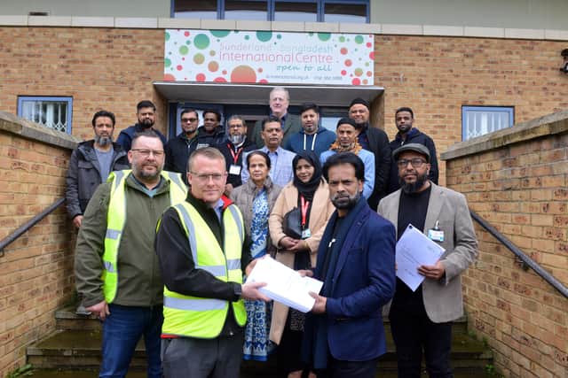 Sunderland Bangladesh International Centre vice chair Syen Shoyjhas Miah hands over the contract to Arcus' Richard Gagen to officially start the £1.2m renovation work.