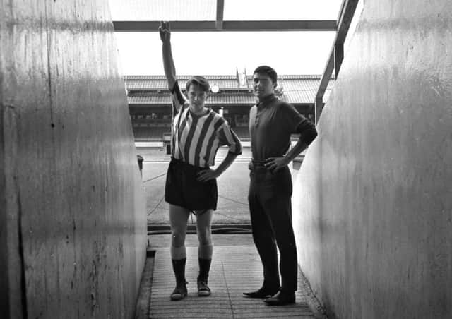 Sunderland players Colin Suggett (left) and Derek Forster pictured opposite the Clock Stand in 1966.