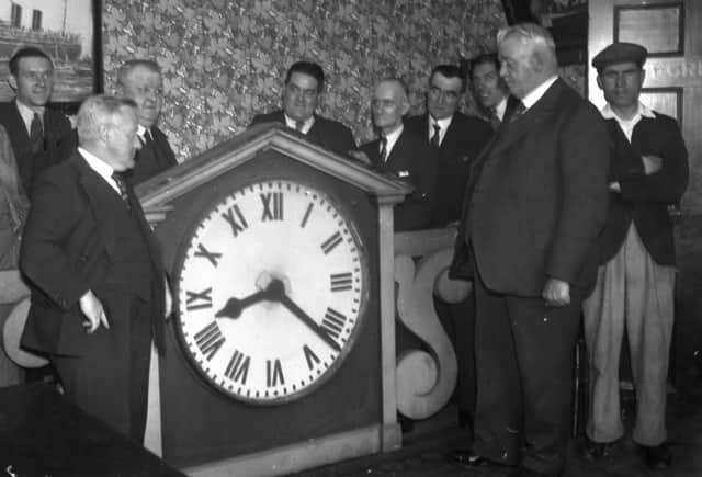 The presentation of the original clock to Chief Constable John Ruddick by Mr John Cochrane, on behalf of the Club's directors.