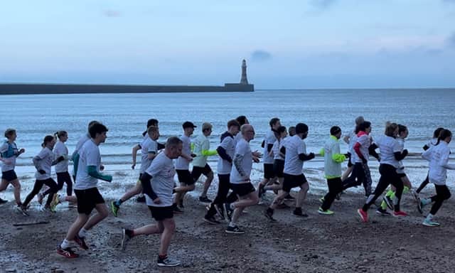 Sunderland City Runs participants celebrate Chariots of Fire on Roker Beach - photo credit Charlotte Davis.