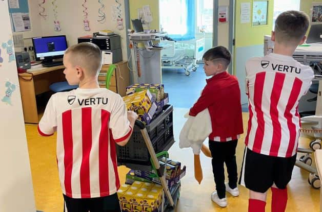 The brothers out on the children's wards at Sunderland Royal Hospital delivering eggs. Submitted picture.