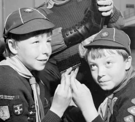 Boys from the 47th St Cuthbert Cub Scout pack who polished their way through 100 boots in 1986.