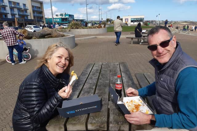 Mr and Mrs Easter - Steve and Frances - tuck in to their food at the seaside.