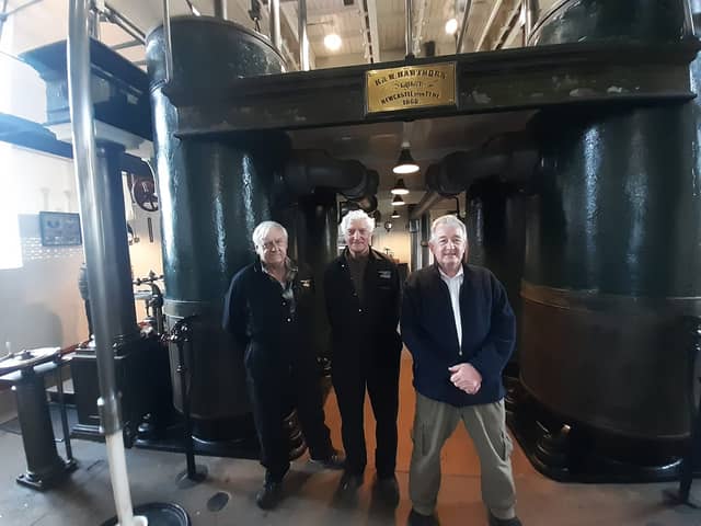 Volunteers Keith Bell, Eddie Moore and Peter Harrison alongside the 1868 steam engine.