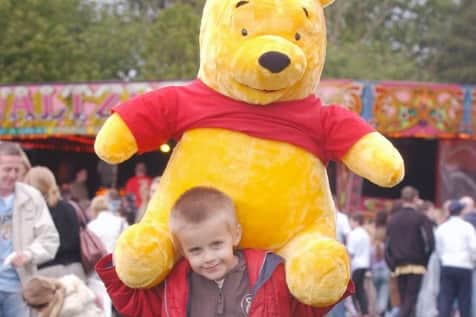Greg Allen got to grips with a giant Winnie the Pooh at Washington Fair in 2006.