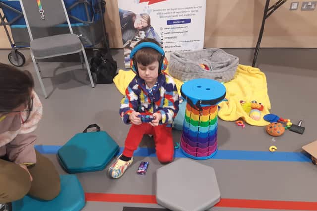 Harvey Smith, 6, playing with some of the sensory toys.