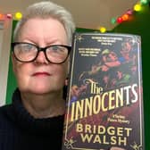 Bridget Walsh with a copy of her book, The Innocents.