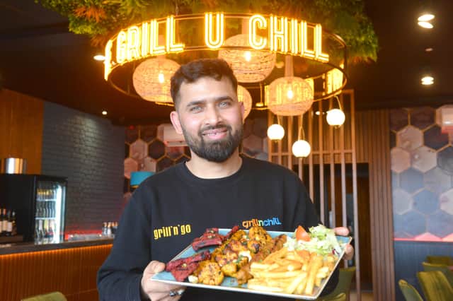 Grill n Chill chef Hussan Shagor with a mixed grill dish