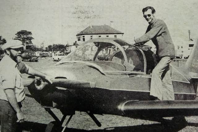 Dr Ridley climbs into the cockpit of the plane he built in his garage, watched by Denis Ord who flew it on its maiden flight in 1976.