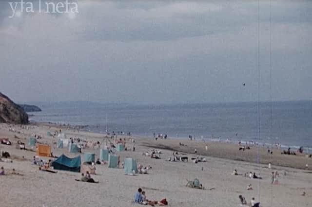 Tents and shelters adorn the beach in this 1957 still from the NEFA film footage. Photo: North East Film Archive
