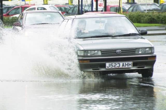 A 1999 flood scene in Newcastle Road at the Wheatsheaf.