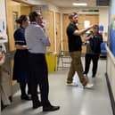 Neil Gibbins shows STSFT Chief Executive Ken Bremner MBE, Ward Manager Sam Charmichael and Matron Carol Gibson his mural on Ward E56. Submitted picture.