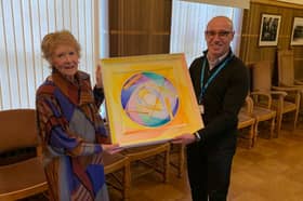 Barbara Hume and Mr Maged Habib with the artwork created by Tom Hume