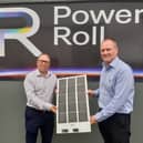 Neil Spann (left) and Ross Nagle with an example of the Power Roll solar panels.