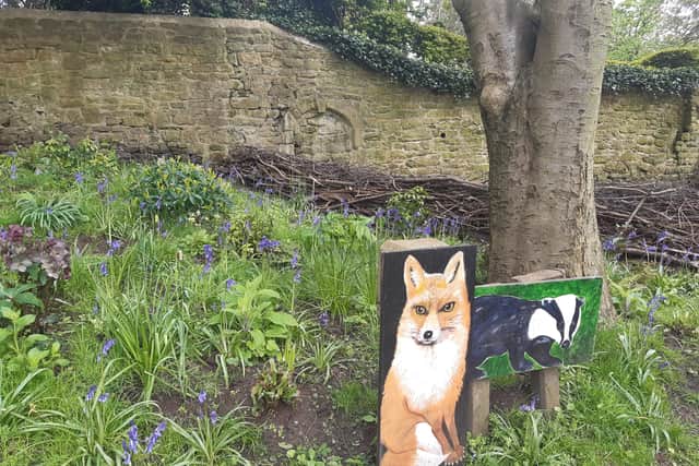 Mssrs Fox and Badger are delighted with the new dead hedge behind the, next to the historic arch.