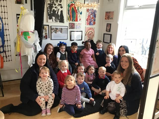 Staff and children at Mill Hill Nursery School celebrate their outstanding Ofsted judgement.