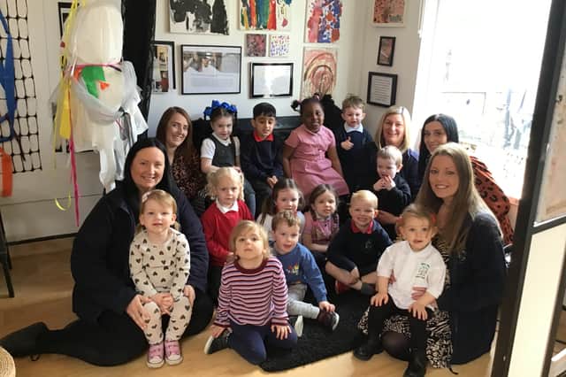 Staff and children at Mill Hill Nursery School celebrate their outstanding Ofsted judgement.