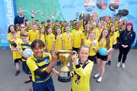 Children and staff at Fulwell Junior School celebrate their sporting success.